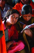 Indian children study in an open hut. Credit: [Ami Vitale/ EFAReport]
