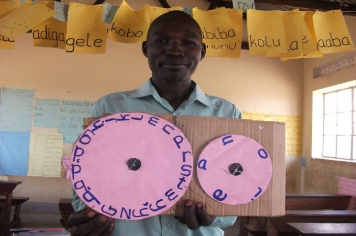 Mr Dramani, a P3 teacher in one of his literacy lessons in local language