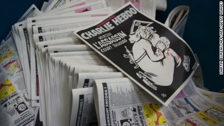 A picture taken on January 4, 2016 at a printing house near Paris shows the cover of the latest edition of the French Satirical magazine Charlie Hebdo bearing a headline which translates as &quot;One year on: The assassin still at large&quot; in an edition to mark the first anniversary of the terror attack which targetted the magazines offices in Paris on January 7, 2015.
One million copies of the special edition will go on sale in France on January 6, on the eve of the first anniversary of the killing of 12 people at the magazine&#39;s Paris offices by brothers Cherif and Said Kouachi.  / AFP / MARTIN BUREAU        (Photo credit should read MARTIN BUREAU/AFP/Getty Images)