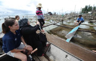 Through South-South cooperation, farmers receive training on different technologies, including fish cage culture. Photo: FAO/Hoang Dinh Nam