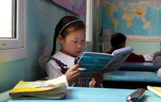 A young girl studies during class break. With rapid growth, the Government of Mongolia introduced a number of programs to improve the country’s education system, especially rural primary education. Photo: Khasar Sandag/World Bank