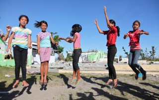 Girls play in the schoolyard at Santo Niño Elementary School in the town of Tanauan, Philippines. Photo: UNICEF/Giacomo Pirozzi