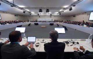 Photo: Ban Ki-moon (centre) addresses a high-level Caring for Climate Business Forum under the Lima-Paris Action Agenda during the COP21.