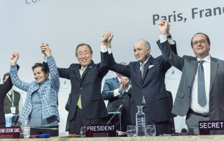 Photo: Secretary-General Ban Ki-moon (second left) Christiana Figueres (right), Executive Secretary of the UN Framework Convention on Climate Change (UNFCCC) Laurent Fabius (second right), Minister for Foreign Affairs of France and President of the UN Climate Change Conference in Paris (COP21) and François Hollande (right), President of France celebrate after the historic adoption of Paris Agreement on climate change on 12 December 2015.