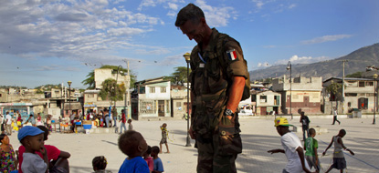 UN peacekeepers join children as they play at Peace Square in Port –au-Prince. 