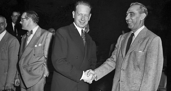 Moments before being installed as Secretary-General, Hammarskjöld (left) with Ambassador Bokhari of Pakistan.