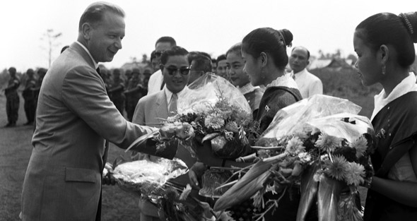 Being welcomed at airport in Vientiane, Laos in 1959.