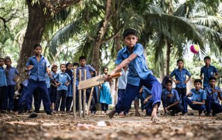 Photo: Rakib Hosain Sabbir, aged 9, a fourth grade student bats during a cricket game at Labsha Government Primary School in Satkhira Sadar, Bangladesh. Photo: UNICEF/Ashley Gilbertson VII