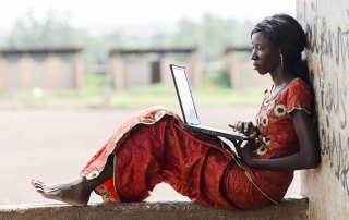 Photo: A woman uses a laptop computer.