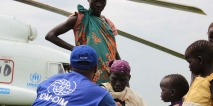 This photo from November 2014 shows IOM providing transportation assistance in South Sudan, moving vulnerable refugees on a UNHCR helicopter. Photo: IOM