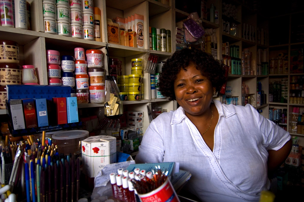 A woman works in a small shop in Ghana. Photo: The World Bank/Arne Hoel