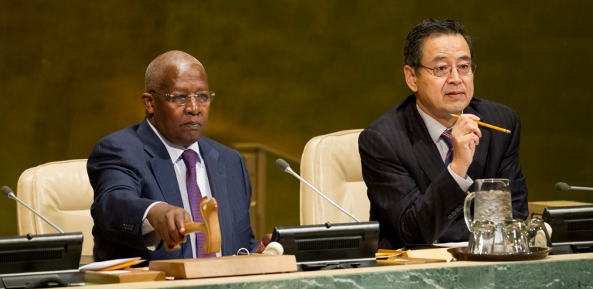 General Assembly President Sam Kutesa (left), and Zhang Saijin, Deputy Director of the General Assembly and Economic and Social Council (ECOSOC) Affairs Division, preside over a meeting on the New Partnership for Africa’s Development (NEPAD). UN Photo/Rick Bajornas