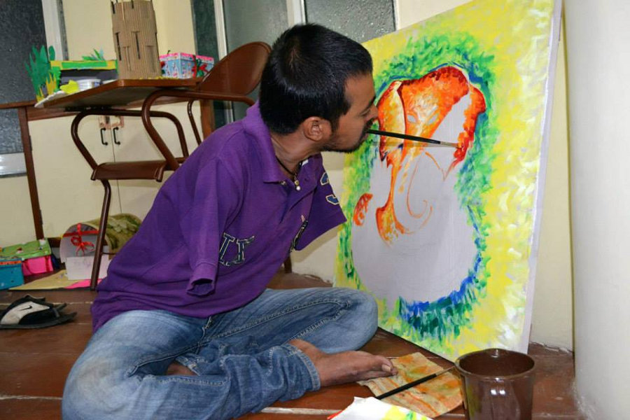 Person painting with the mouth