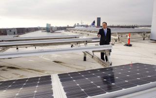 Photo of Secretary-General Ban Ki-moon viewing solar panels.