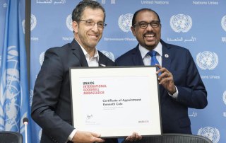 Photo: Michel Sidibé (right), the Executive Director of UNAIDS, introduces fashion designer Kenneth Cole as an International Goodwill Ambassador. UN Photo/Mark Garten