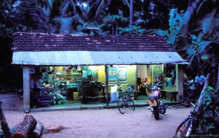 Village shop at dusk in Sri Lanka lit by solar panels. Photo: World Bank/Dominic Sansoni