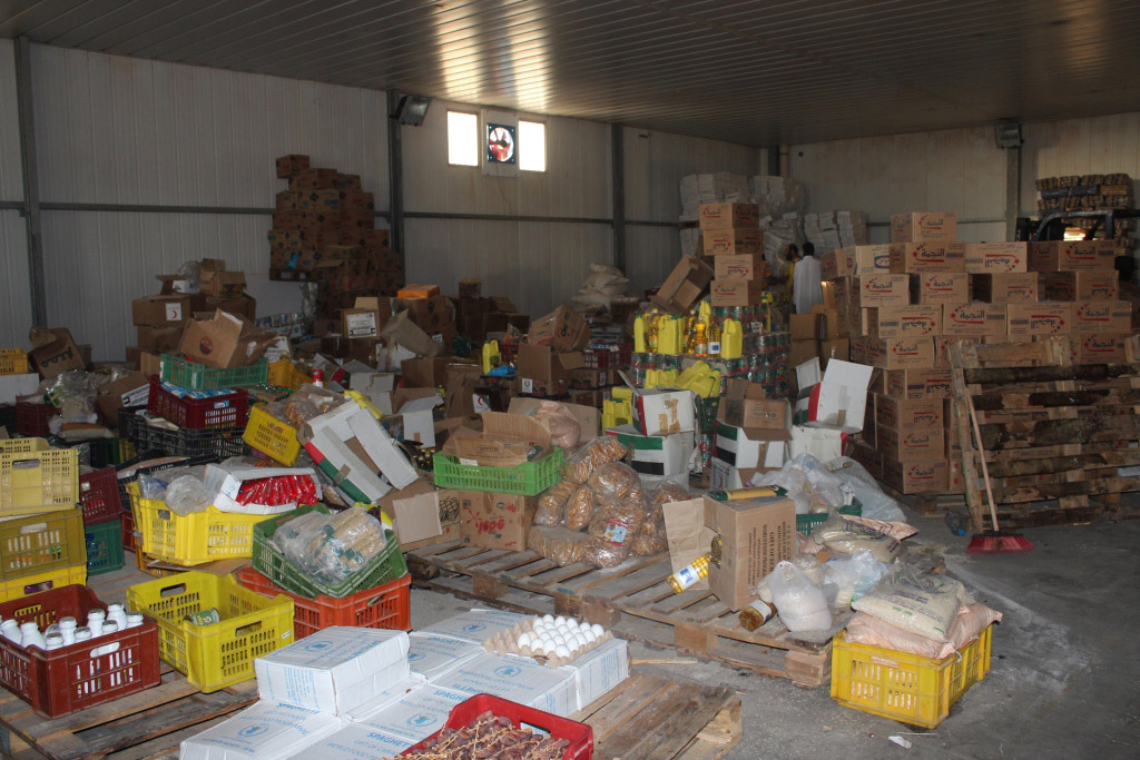 Humanitarian food assistance at the Zintan main food warehouse in the Nafusa Mountains, Libya. Photo: OCHA/Jihan El Alaily