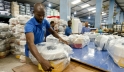 Factory workers package products at Decorplast, a manufacturer and regional exporter of injectionmoulded plastic goods in Ghana. Panos/ Nyani Quarmyne