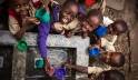 Children fill their cups at a water point built by UNICEF at Kanyosha III primary school in Bujumbura, Burundi. Photo: UNICEF/Rosalie Colfs