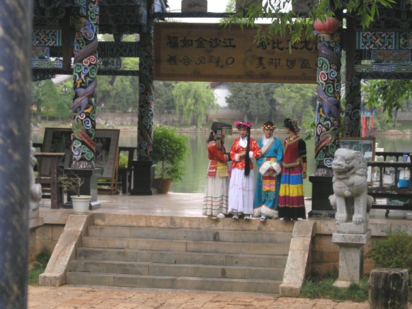 Four girls in the dress of local minority cultural groups