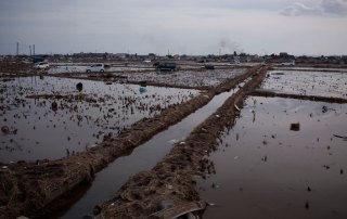 Photo: On 14 March 2011, tsunami damage extends to the horizon, in the city of Sendai, in Miyagi Prefecture, Japan.