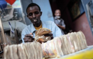 A money exchanger in Mogadishu, Somalia - UN Photo/ Stuart Price