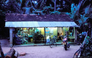 Village shop at dusk in Sri Lanka lit by solar panels. Photo: World Bank/Dominic Sansoni