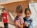 Unos niños en un campamento de refugiados del ACNUR