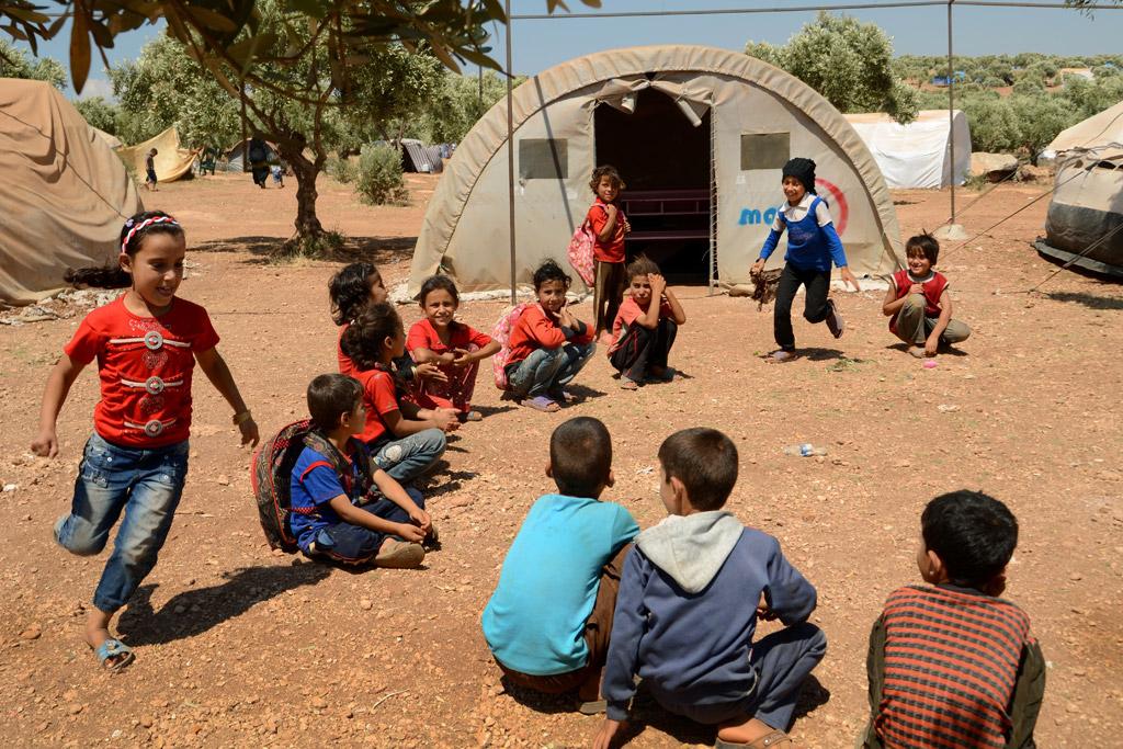 Children play games at Atmeh IDP camp in Idlib province, north Syria. Photo: OCHA