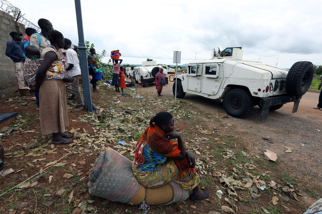 Displaced civilians leave the UNMISS (UN Mission in South Sudan) base in UN House, after seeking refuge at the base in the wake of recent fresh clashes in Juba between soldiers of the Sudan People