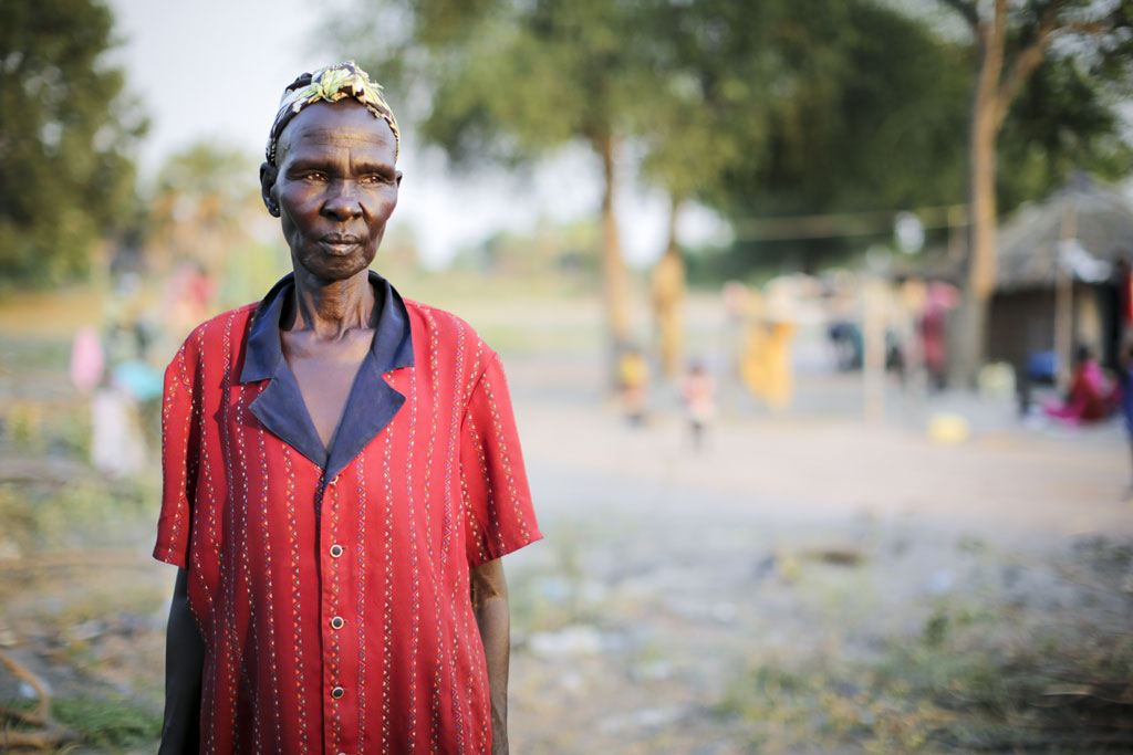 Of Nuer ethnicity, Adhieu Chol moved to Lakes state’s Rumbek long ago to marry a Dinka man from the area. Since September 2015, she has provided sanctuary to many internally displaced people from Unity state looking for safety in Rumbek, South Sudan. Photo: UNHCR/Rocco Nur