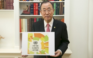 sg holding a sign that reads, 'I'm for climate action" (request from the climate action people)