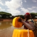 A woman drawing water from a man-made pond in drought-stricken Somali.  Photo: UNDP Somalia