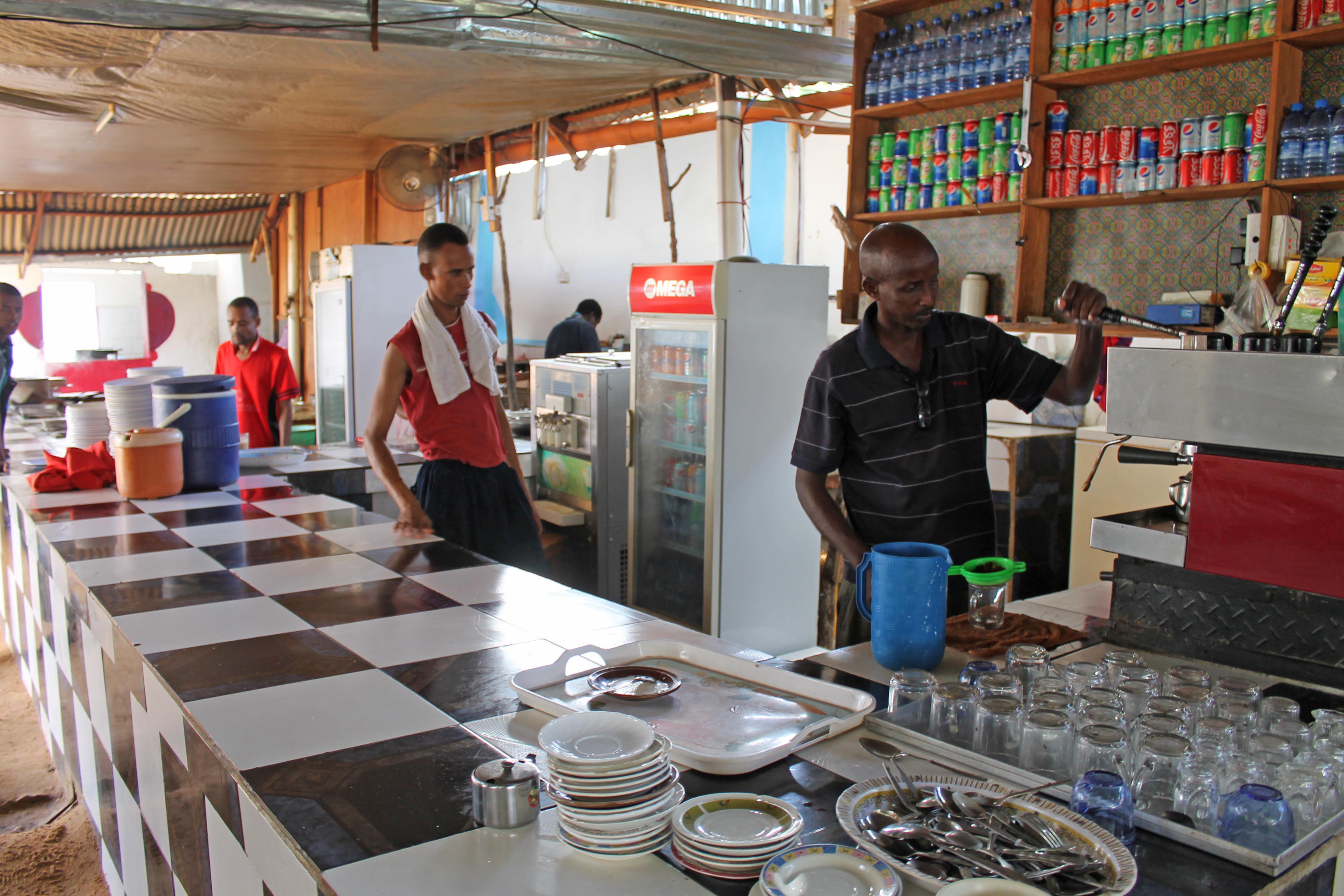 Somalis prepare coffee for customers in a  Mogadishu  restaurant. Photo: AP Photo/Farah Abdi Warsameh