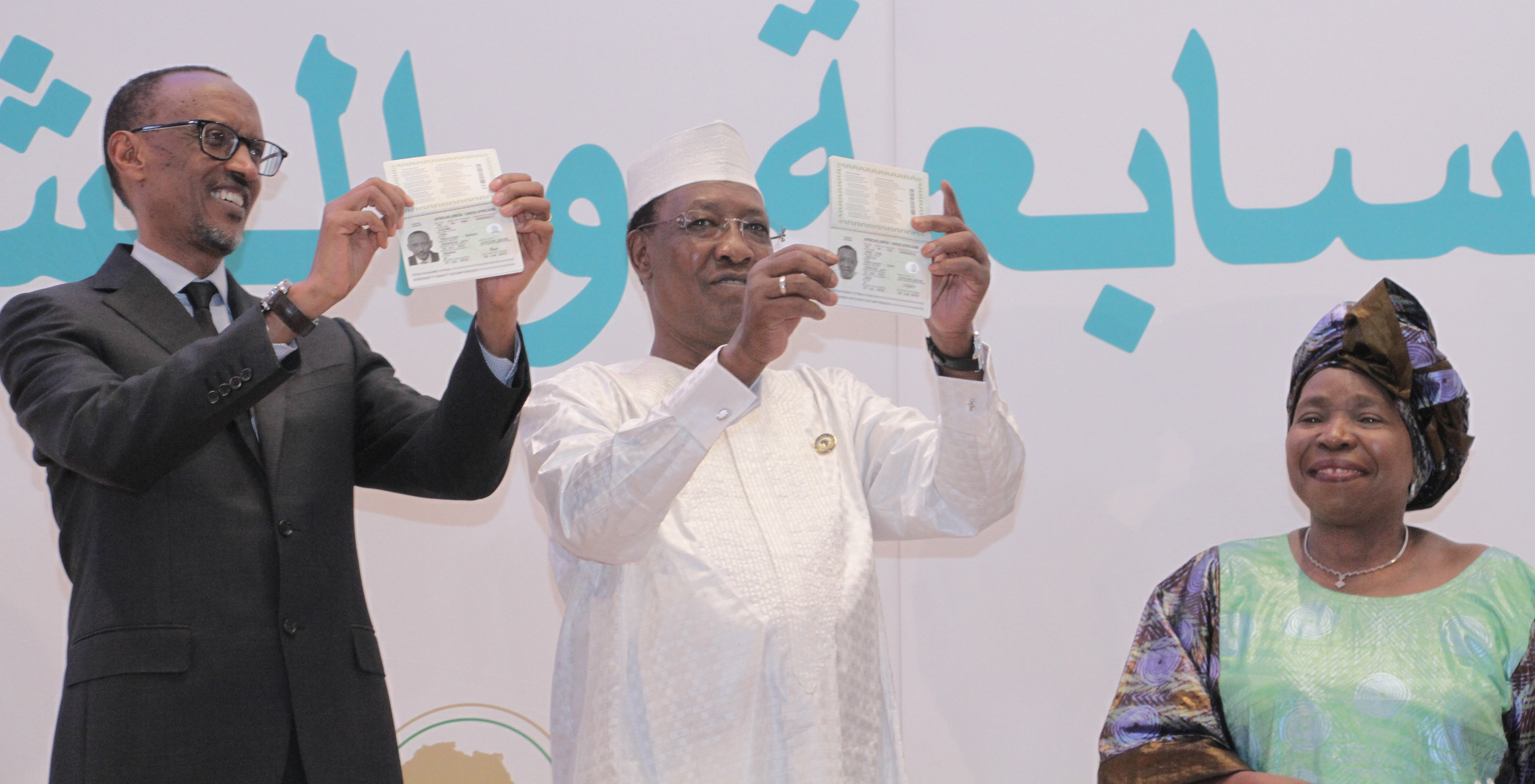 Rwandan President Paul Kagame and Chadian President Idriss Déby, flanked by African Union Commission Chairperson Nkosazana Dlamini-Zuma, show off their new pan-African passports at the AU summit in Kigali in July 2016. Photo: African Union