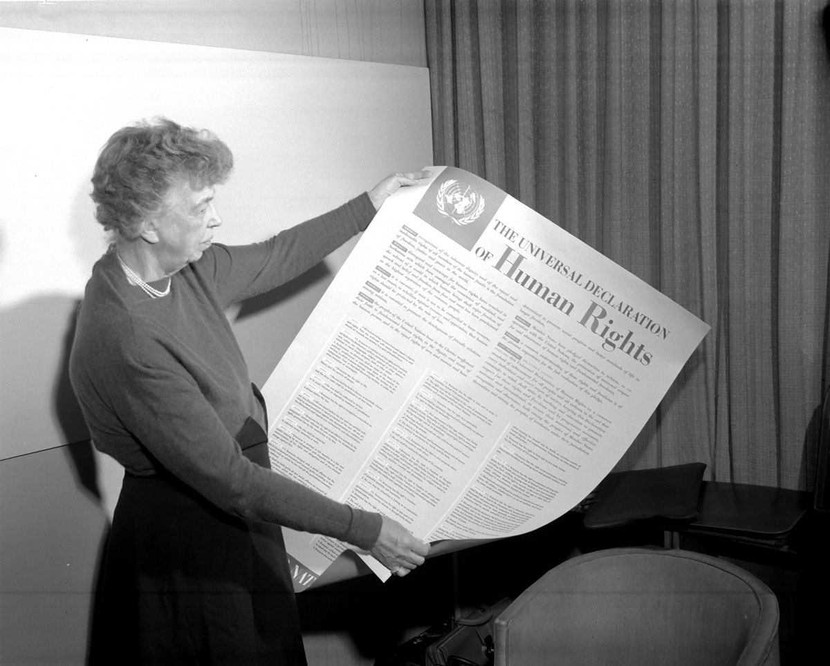 Mrs. Eleanor Roosevelt of the United States holding a Declaration of Human Rights poster in English