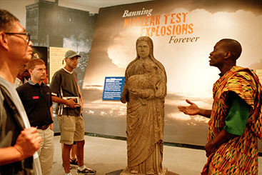 A UN tour guide briefs a group of visitors