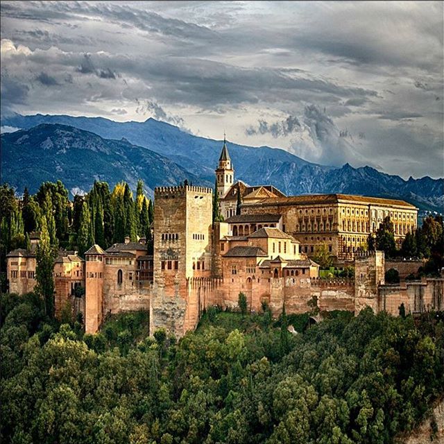 #WorldHeritage: The Alhambra is, as medieval poets called it, "a pearl set in emeralds," an allusion to the colour of its buildings and the woods around them. The sheer red walls of the Alhambra fortress and residence rise from the medieval Granada woods. It was the former rural residence of the emirs who ruled this part of Spain in the 13th and 14th centuries. Inside is one of the more splendid sights of Europe: a network of magnificently decorated royal Arab palaces and green grass gardens of the medieval period. 
Thanks to Jit Bag for this beautiful photo, via Creative Commons