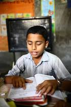 13 years old Asadul study in class three at "Unique Child learning Center" in Bangladesh