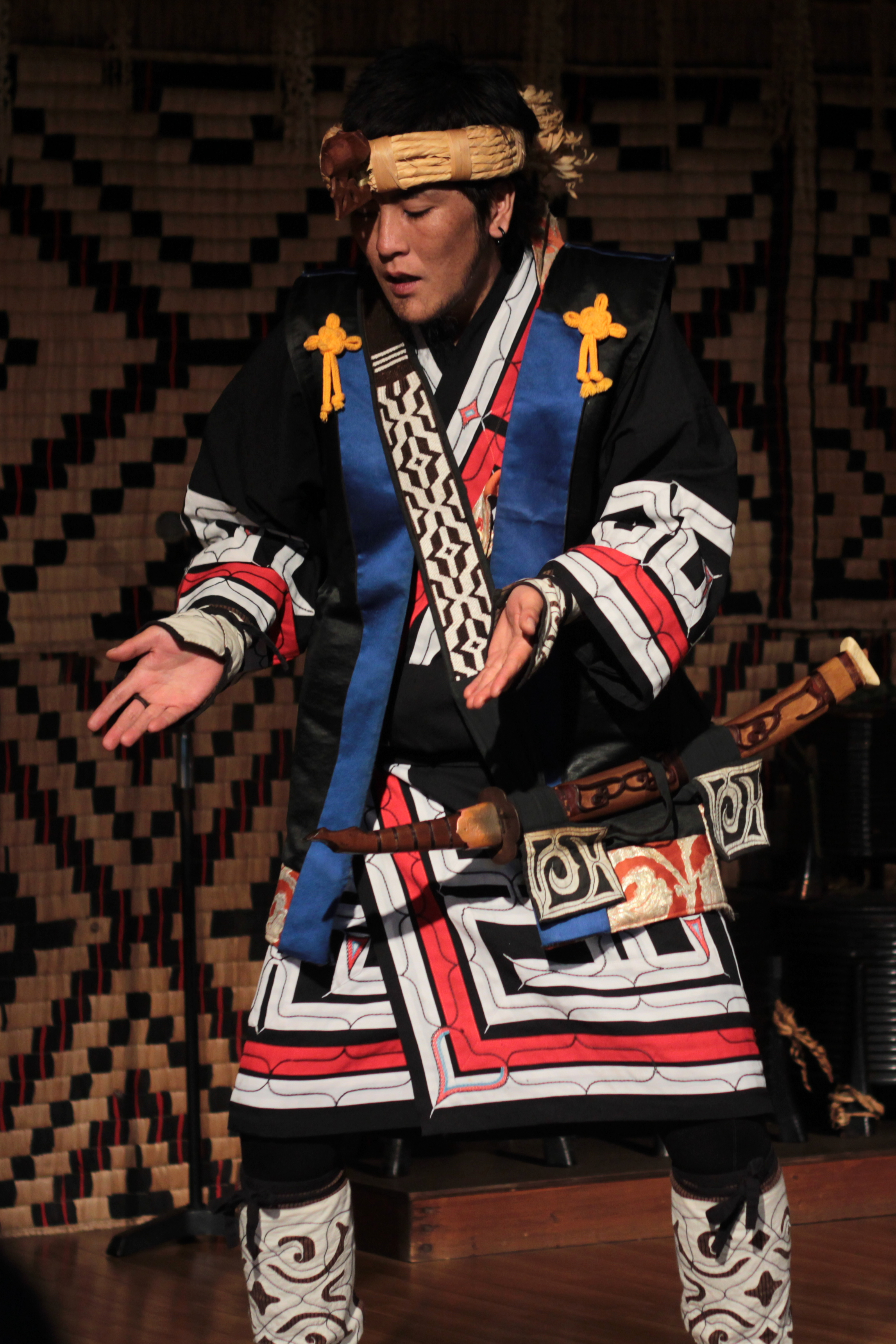 Member of the Ainu community performing a traditional Ainu dance at the Ainu Museum in Shiraoi, Hokkaido