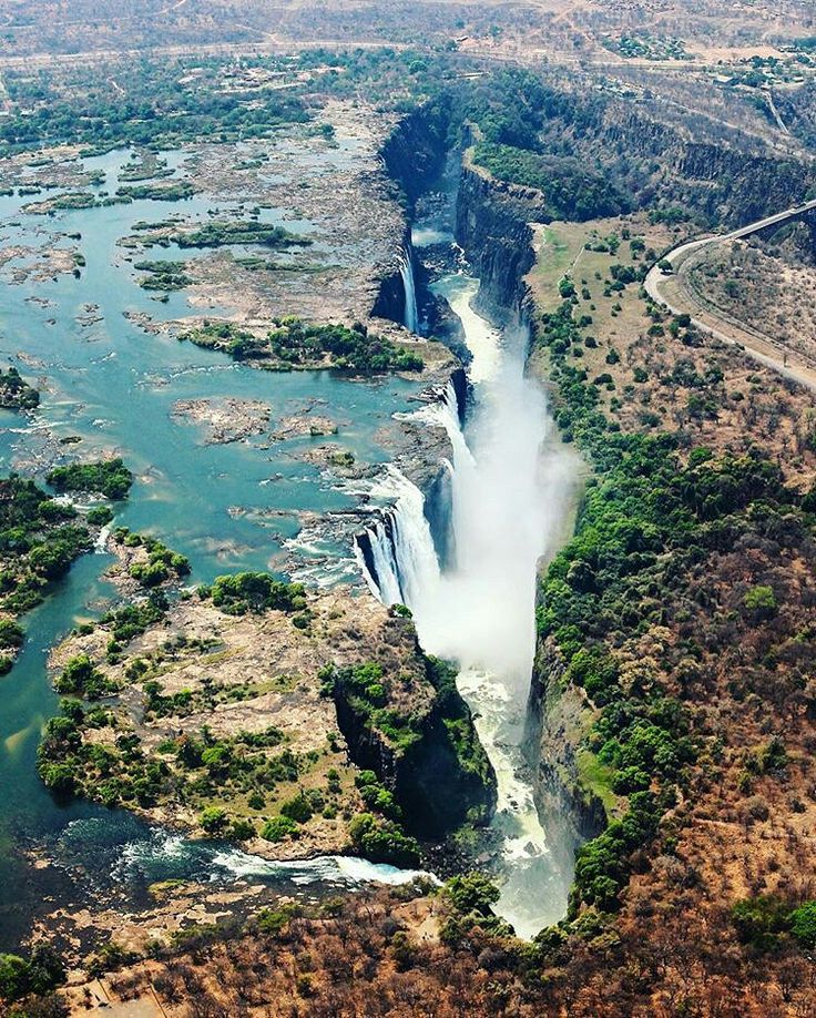 The magnificent Victoria Falls on the Zambezi River at the border of Zambia and…