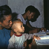 Literacy courses for women, adult education. Woman with little child