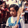 Christian procession, young girl carrying offerings