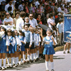 Religious procession, children marching with school banner