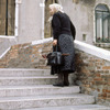 Everyday life in Venice, woman, stairs, bridge