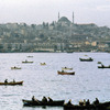 View on Bosphorus bank and port activities, boats, houses and mosque