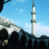 Historical area of Suleymanie Külillie, mosque courtyard, minaret, Ottoman arch
