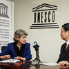 Ms Irina Bokova, Director-General of UNESCO with a journalist of the Chinese pr