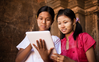 Myanmar girls using a tablet @szefei/shutterstock