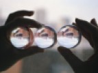 Three glass spheres reflecting the same reality.